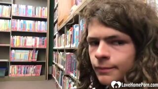 Petite horny teen gives a handjob in a public library