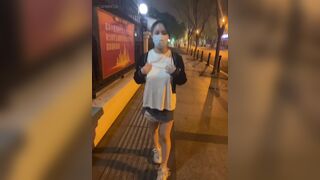 Chinese girl being naughty in Public street